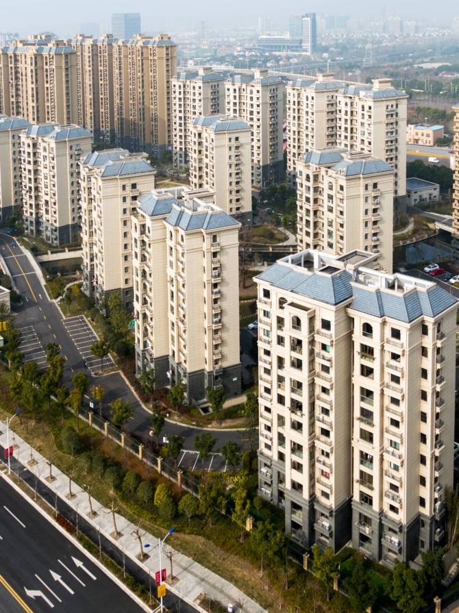aerial view of the district in Shanghai with roads and high-rise buildings.